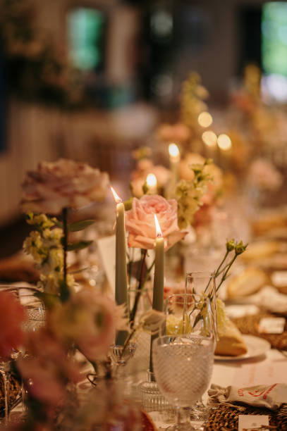 istock Dining table with flowers and candles 2165974296