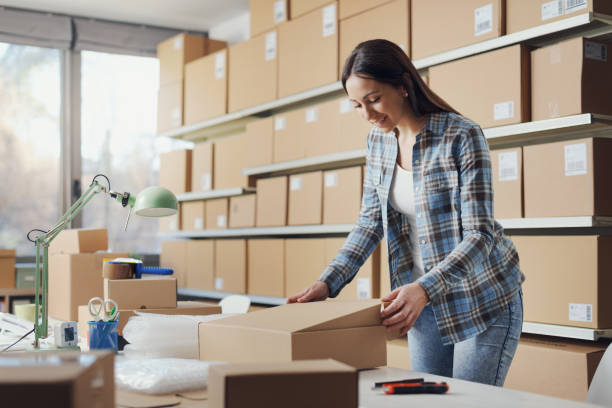 istock Woman closing a delivery box 2165979407