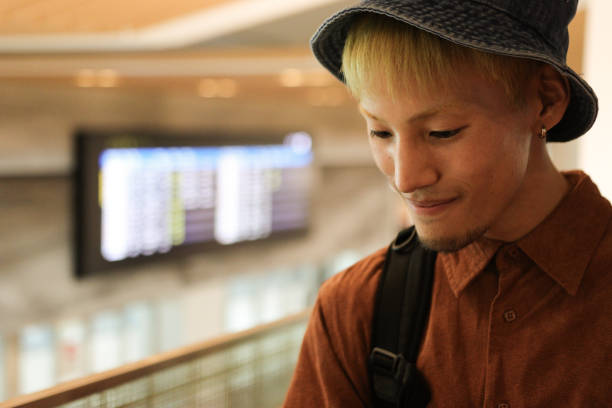 Young Asian Man at airport terminal