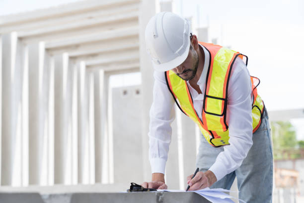 istock Male engineer construction working at construction site. Male engineer builder wear white helmet working at construction site 2165979795
