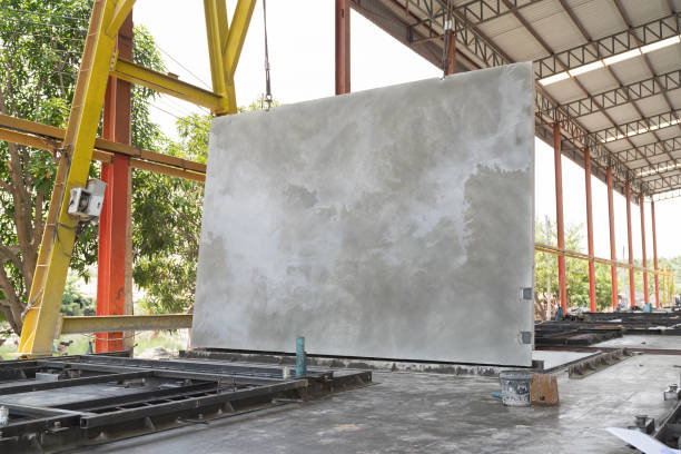 Precast concrete wall at line conveyor at construction site. Precast concrete wall at prefabricated wall factory
