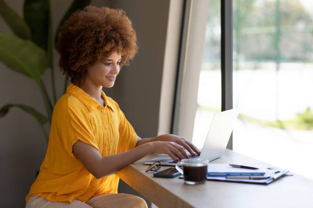 istock Young businesswoman working on a laptop 2165982794