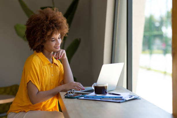 istock Young businesswoman working on a laptop 2165982916