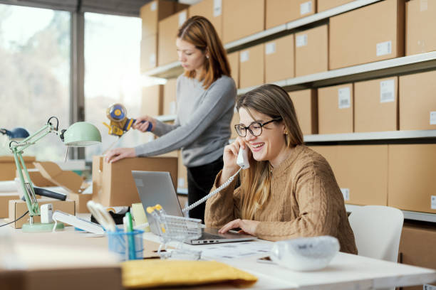 istock E-commerce store owner taking orders on the phone 2165983415