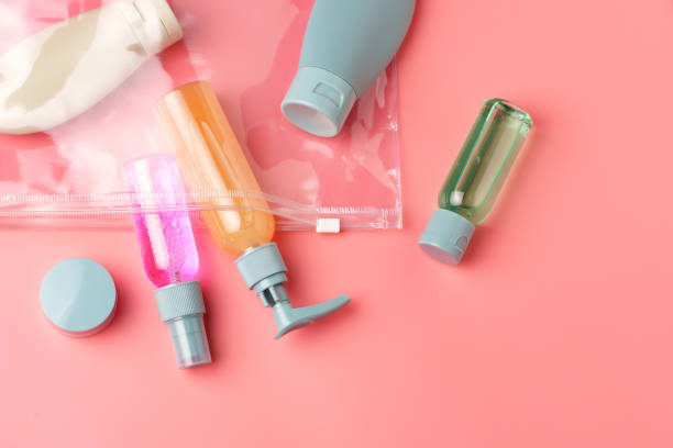 istock Clear Plastic Bag Containing Travel-Sized Toiletries on Pink Background 2165985790