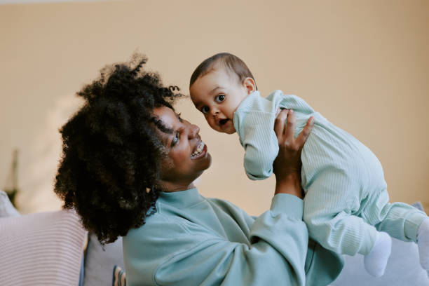 istock Young African American Mother Playing with Her Child 2165986878