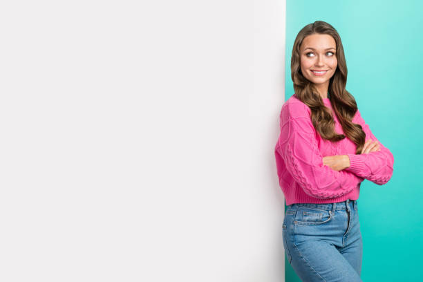 istock Photo of dreamy cute lady dressed knitted pullover arms folded looking placard empty space isolated teal color background 2165988919