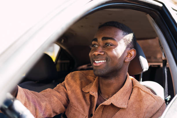 istock Cheerful black man in car 2165989490
