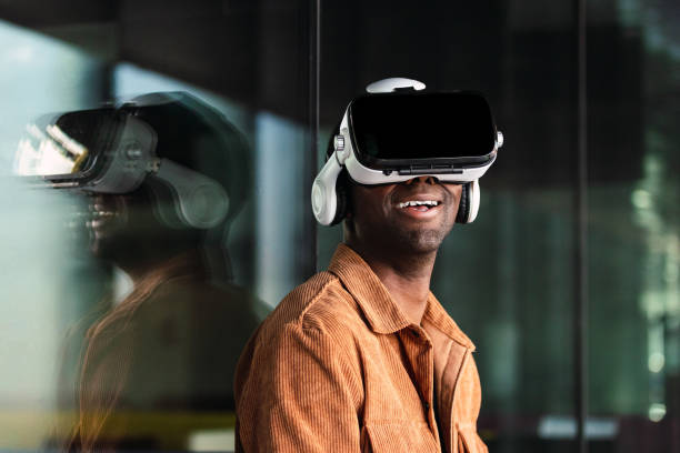 istock Cheerful black man in VR headset 2165990382