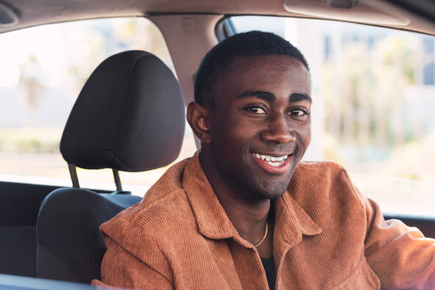 istock Cheerful black man in car 2165990396
