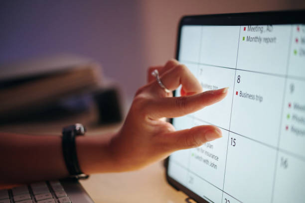 istock Reviewing Calendar Plans On Digital Tablet 2165997239
