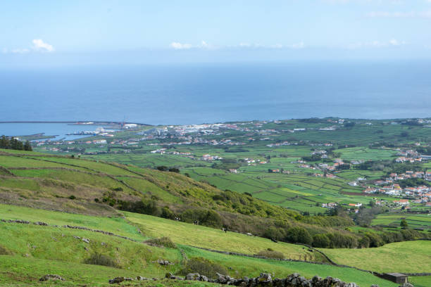 istock Lush green fields of the Azores, divided by stone walls forming rectangular plots. 2166000372