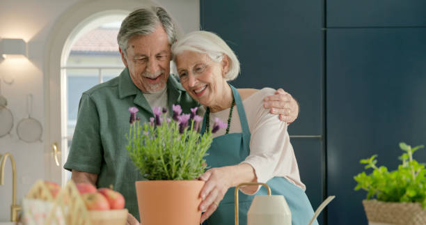 istock Senior couple gardening at home 2166000434