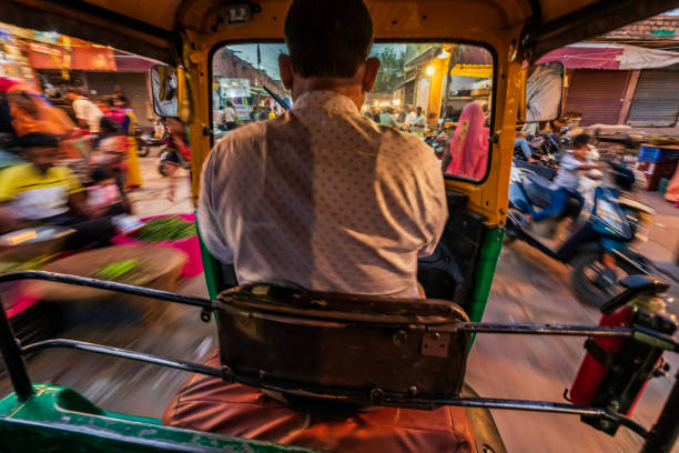 istock Indian man drives auto rickshaw (tuk-tuk), India 2166003469