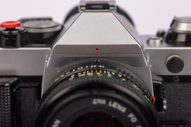 istock Front close-up of a classic camera on a white backdrop, emphasizing the detailed craftsmanship and vintage aesthetics. 2166004364