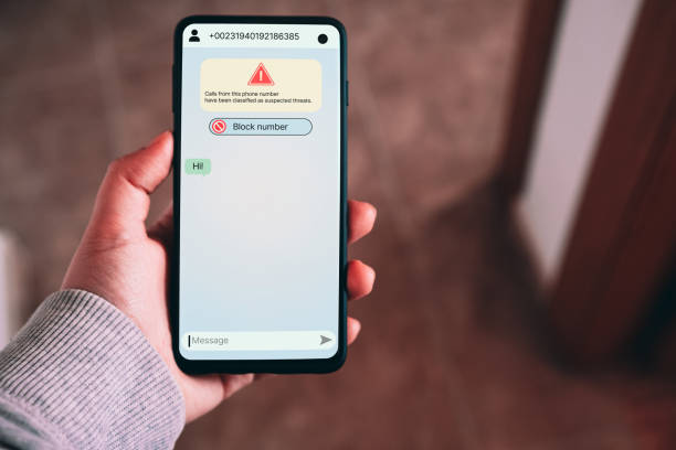 istock Woman receives message from suspected number scam. 2166006415