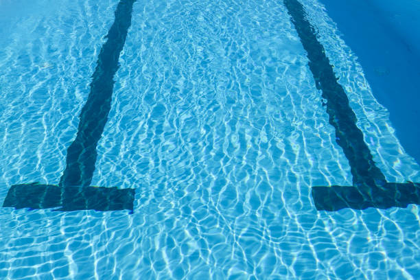 Two black tires on the edge of the pool are used as simple floats