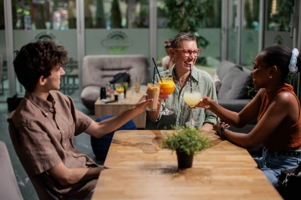 istock Friends having drinks in a cafe 2166010462