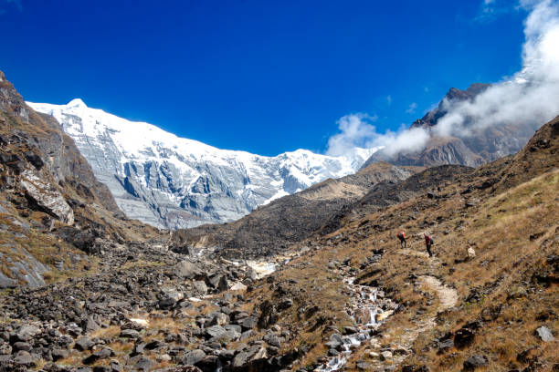 istock Beautiful mountain scenery. River, valley, snow, blue sky, white clouds. In-depth trip on the Sonamarg Hill Trek in Jammu and Kashmir, India 2166012273