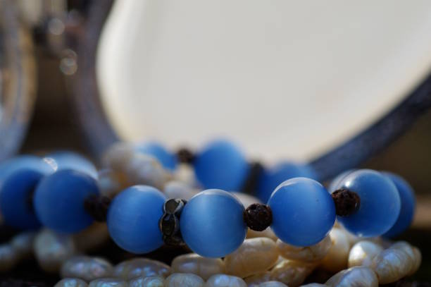 A jewelry box and various decorations. Necklace, beads.
