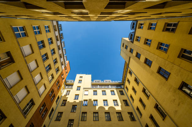 istock Low angle view of yellow apartment building 2166018953