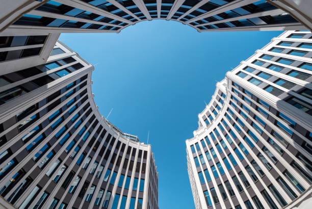 istock Low angle view of modern office building against clear sky 2166018966