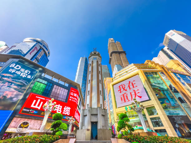 Chongqing, China - August 6, 2024. A vibrant view of the Jiefangbei Central Business District (CBD) in Chongqing, China, featuring the iconic People's Liberation Monument surrounded by modern skyscrapers and colorful advertisements.