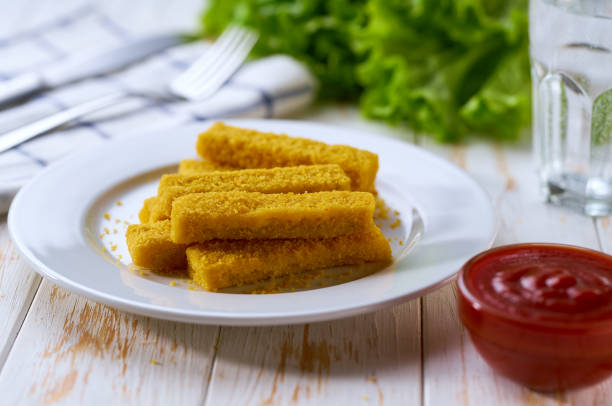 istock Fried fish sticks. Crispy Fish fingers with lemon and sauce ready to eat. 2166024059