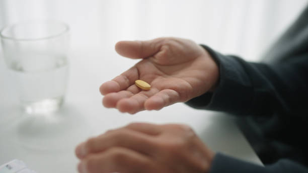 istock Mature woman taking medicine. 2166024771
