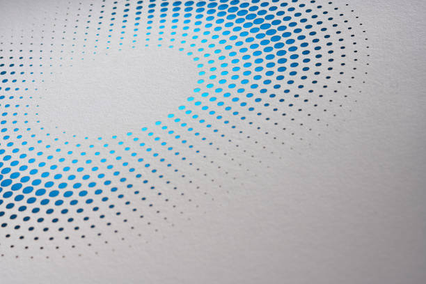 istock Elegant dotted paper design forming a gradient circular pattern transitioning from dark to light blue hues. 2166030811