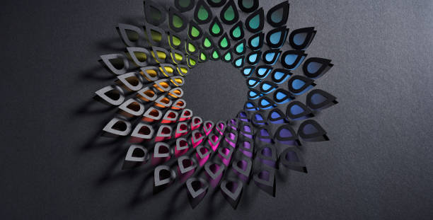 istock Intricate cut-paper design on dark background forming a teardrop-shaped flower pattern with a rainbow gradient. 2166030836