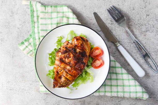 istock a plate of grilled chicken breast with vegetables 2166031348