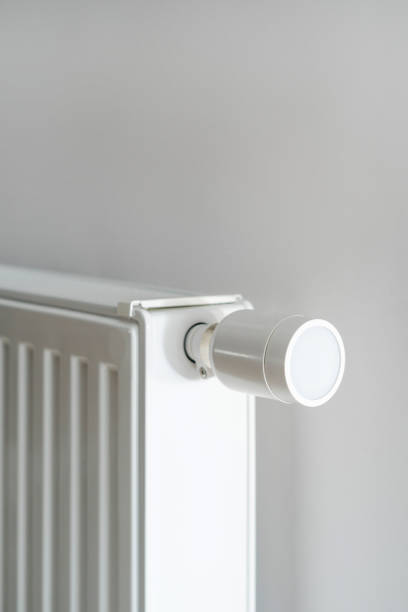 istock Modern and white radiator with thermostat in apartment 2166031485