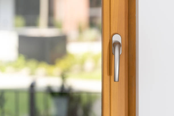 istock Closeup of a silver handle, positioned on wooden window frame 2166031532