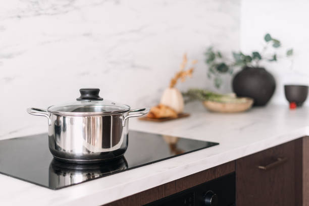 istock Glass ceramic stove with metal pot in modern kitchen 2166032423
