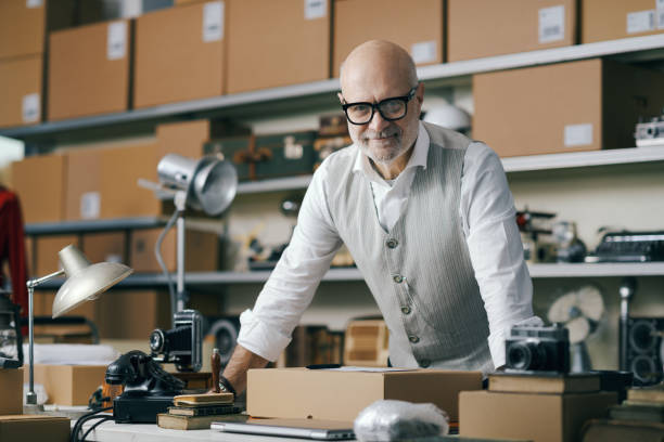 istock Confident business owner posing in his second-hand vintage shop 2166033182