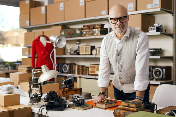 istock Confident business owner posing in his second-hand vintage shop 2166034429
