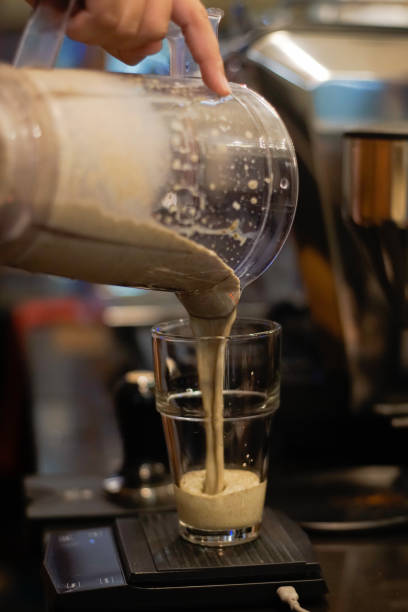 istock Pouring milk shake into glass 2166034800