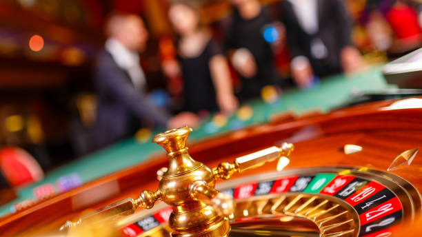 istock Friends playing roulette in casino 2166038959