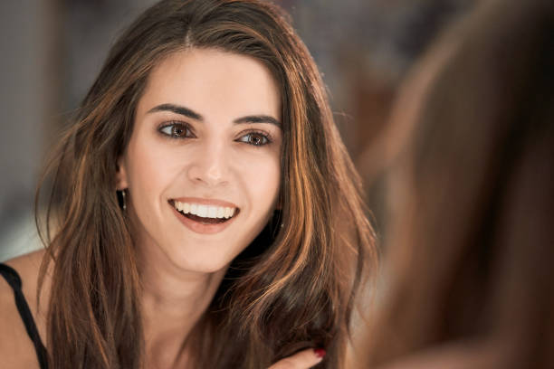 istock Delighted woman looking at mirror in studio 2166041410
