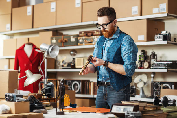istock Expert checking a vintage object in a shop 2166041606