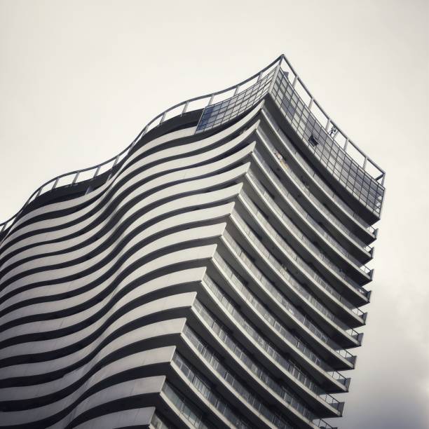 Modern multistory building with wavy exterior. Wave like building view.
