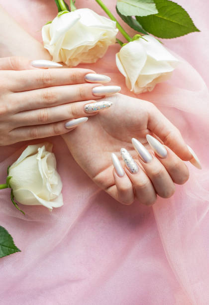 istock Female Hands with beautiful pearl manicure 2166042796