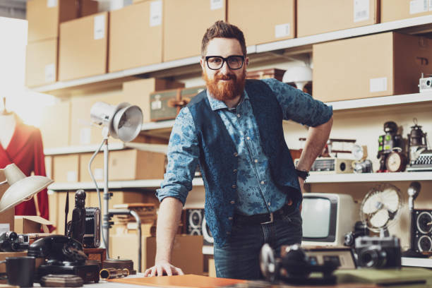 istock Young confident business owner posing in his shop 2166043105