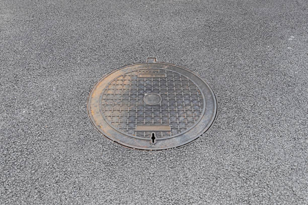 istock manhole on the floor asphalt. (Manhole cover) 2166045609