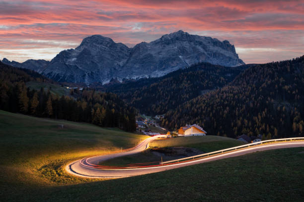 istock Glowing road at the autumn Dolomite Alps 2166045914