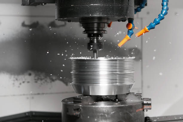 istock Metalworking, a numerically controlled milling machine cuts complex metal parts with high precision. 2166046501