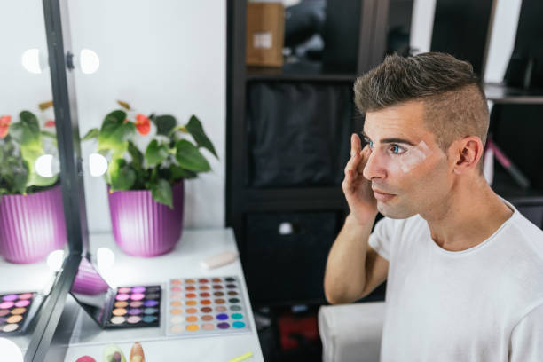 istock Drag queen artist doing his makeup in the dressing room. 2166046803