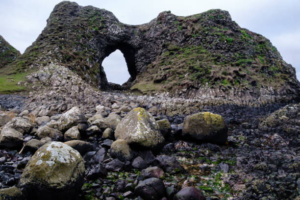 Beautifully shaped very old rock formations and various rocks and boulders on beach at Ballintoy in Co. Antrim, Northern Ireland on the Causeway Coast. The area featured in the TV series Game of Thrones.