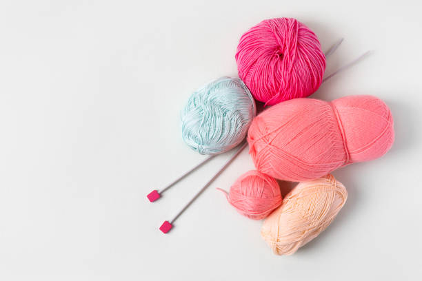 Close up on woman's hands knitting.